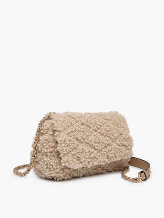 Tan sherpa crossbody bag with top flap, gold chain strap, and side view