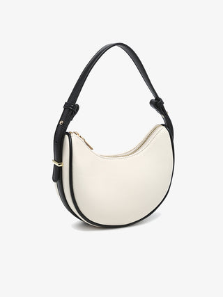 Black and white Warsaw vegan shoulder bag, curved hobo silhouette with zip top