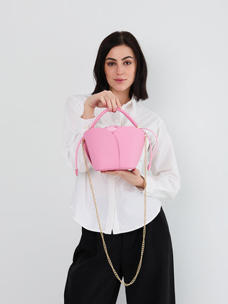 Bubblegum pink vegan petal bucket bag with long gold-tone chain straps