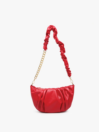 Red ruched shoulder bag with gold chain strap and gathered front panel.