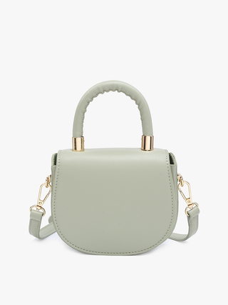 Vegan mini saddle bag in light sage with gold-tone handle and crossbody straps.