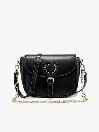 Black vegan crossbody bag with studded heart emblem on front flap and chain strap