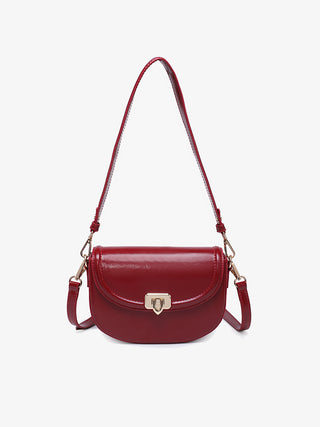 Bristol vegan crossbody in cherry red, curved flap with metal clasp and shoulder strap