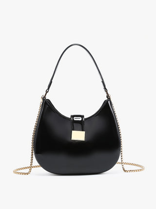 Black high-gloss crossbody bag with gold chain strap and square clasp on front