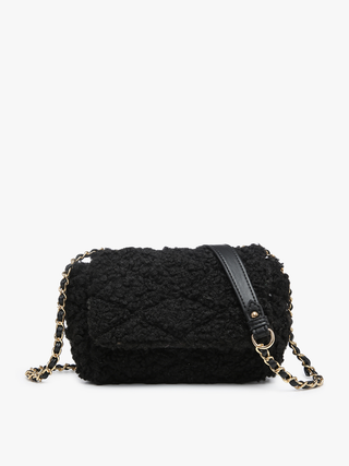 Black sherpa crossbody with flap closure and gold chain shoulder strap
