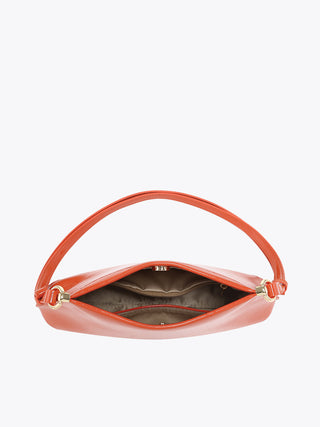 Coral vegan shoulder bag interior view with snap closure and fabric lining