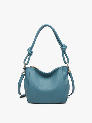 Ocean blue vegan knotted shoulder bag with twisted rope handles and small exterior pockets