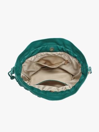 Emerald green ruched bucket bag interior with beige lining and front zipper pocket