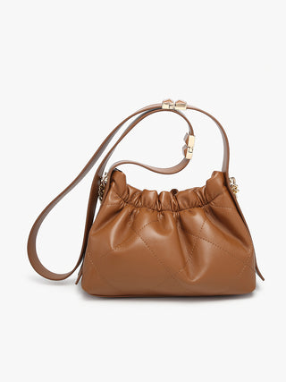 Ruched vegan bucket bag in brown with ruched drawstring top and gold chain strap