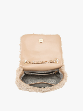 Tan sherpa crossbody bag with flap open, showing patterned interior pocket lining