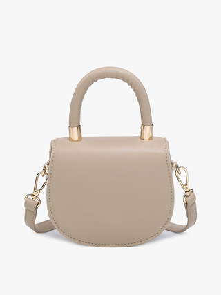 Vegan mini saddle bag in taupe with gold-tone top handle and adjustable crossbody straps.