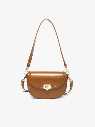 Bristol vegan crossbody in brown, rounded flap with metal clasp and adjustable shoulder strap