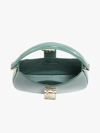 Inside view of jade green high-gloss crossbody, showing main compartment and closure