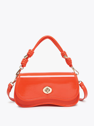 Osaka vegan crossbody in bright orange with braided handle, flap front, and crossbody strap