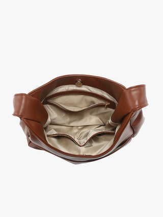 Open interior of tan vegan hobo bag with lining and snap button