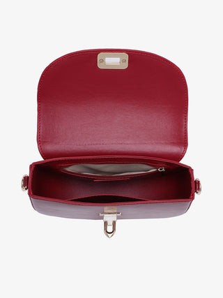 Cherry red crossbody bag interior view, top flap open with magnetic latch and metal pull