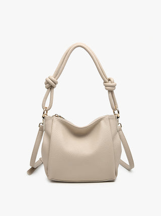 Greige knotted shoulder bag with slouchy shape, rope handles, and side strap detail