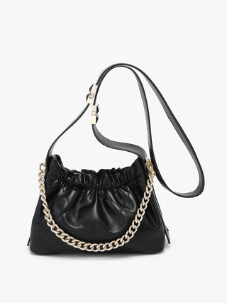 Ruched vegan bucket bag in black with gold chain strap and gathered ruched front