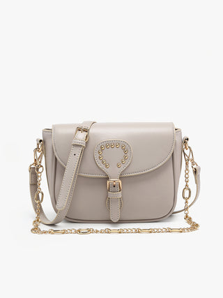 Greige vegan crossbody bag with studded heart emblem on front flap and chain strap