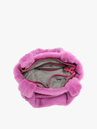 Purple fuzzy satchel open to show patterned inner lining and zipper pocket