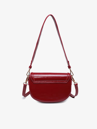 Bristol vegan crossbody in cherry red, front flap with metal clasp and side strap tabs